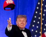 US President Donald Trump throws a Trump 2028 cap during mentalist Oz Pearlmans performance at the White House Correspondents Association Dinner at the Waldorf Astoria hotel in Washington, DC, US, July 24, 2026. -  Jonathan Ernst, Reuters