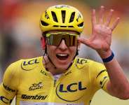 UAE Team Emirates XRGs Tadej Pogacar wearing the yellow jersey celebrates after completing stage 21, 26 July 2026. -  Stephanie Lecocq / Reuters