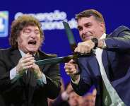 Brazilian Senator Flavio Bolsonaro, right, accompanied by Argentinas President Javier Milei shown at the Liberal Party convention confirming Bolsonaro as a presidential candidate, Sao Paulo, Saturday, July 25, 2026. -  Ettore Chiereguini, AP