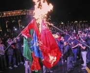 People burn representations of the Turkish and Azerbaijani flags during a demonstration marking the 110th anniversary of the Armenian genocide in Yerevan, Armenia, on 23 April 2025. - AP - Hayk Baghdasaryan