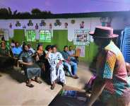 Hon. Ashietey ( in hat ) addressing branch members at one of the branches he visited