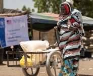 Yakura Usman, 70, walks after receiving food assistance at a distribution centre from where WFP provides relief, including in-kind food rations, electronic food vouchers, and specialized nutrition support for vulnerable households and internally displaced persons in Dikwa, Borno State, Nigeria, May 13, 2026. - via REUTERS - Khalid Hamza