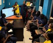 Albert Siaw Yeboah, Lead of the UPSA Developers Hub demonstrates the Tix4u platform to staff of Silverbird Cinemas Ghana during the academic-industry engagement at Accra Mall.