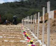 Workers prepare graves on the day of the burial of earthquake victims, in the aftermath of the June 24 earthquakes, at La Esperanza Cemetery, in La Guaira, Venezuela, July 6, 2026. -  Adriano Machado, Reuters