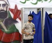 A man prepares to cast his ballot at a polling station during parliamentary elections in Algiers on July 2, 2026. -  AFP
