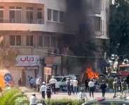 Emergency personnel work as smoke and fire rise at the site where explosive devices blew up near a hotel where French President Emmanuel Macron was meant to be staying, in Damascus, Syria, in this screengrab obtained from a video, July 7, 2026. -  