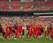 Switzerland players celebrated with their fans at the Vancouver Stadium after seeing off Colombia in a penalty shootout. - Getty Images via AFP - DAVID RAMOS