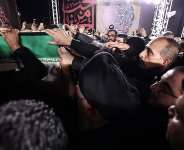 Iraqi officials and senior politicians received the remains of Khamenei on Tuesday night at Najaf international airport. -  Media office of senior politician and cleric Ammar al-Hakim via AFP