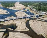 A bridge spans the dried out Loire River in western France on July 10, 2026 -  Damien MEYER / AFP/File