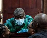 Ugandas veteran opposition leader Kizza Besigye, and his aides seen at High Court, in Kampala, Uganda, on 29 December, 2025. - AP - Hajarah Nalwadda