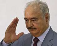 Libyas eastern military chief Khalifa Haftar waves after a speech at the local headquarters of the High National Election Commission in Benghazi on November 16, 2021. -  Abdullah Doma, AFP