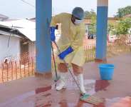 A health worker mops the floor of the Ebola treatment centre in Bunia General Hospital Ituri, eastern DR Congo, Tuesday, 11 August, 2026. - AP Photo/Dieudonne Dirole - Dieudonne Dirole