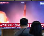 A TV screen shows a file image of North Koreas missile launch during a news program at Seoul Railway Station on August 12, 2026. -  Ahn Young-joon, AP