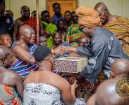 Kojo Antwi presents his new book to Otumfuo and Asantehemaa
