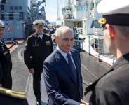 Pool photograph distributed by the Russian state agency Sputnik, President Vladimir Putin greets officers onboard the Russian Navys guided missile cruiser Varyag on far eastern Sakhalin Island on August 13, 2026. -  Gavriil Grigorov, AFP (Pool)