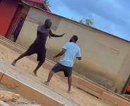 VIDEO Tense street fight between two men draws crowd of onlookers