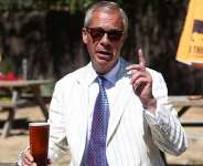 Reform UK party leader Nigel Farage drinks a pint on the day of voting in the Clacton by-election triggered by his own resignation. - Toby Shepheard, Reuters