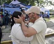 A former political prisoner reunites with a relative after being released outside El Rodeo I prison in Guatire, Venezuela. - Juan Barreto, AFP