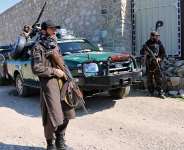 Taliban police stand guard in the Momand Dara district of Nangarhar province, Afghanistan, near the border with Pakistan, on 13 March 2026. -  AP - Hedayat Shah