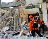 In this image released by the Indonesian National Search and Rescue Agency (BASARNAS), rescue workers search for victims in a damaged building following an earthquake in Maumere, in the province of East Nusa Tenggara, Indonesia, on August 15, 2026. -  Basarnas via AP