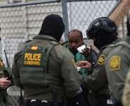 US Border Patrol agents detain an unidentified man of Somali descent in Minneapolis, Minnesota, on 8 January, 2026. - AFP - OCTAVIO JONES