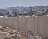 The separation wall next to the Arab neighbourhood of Al-Eizariya, near where the Israeli government says housing units will be built as part of the its E1 settler project, pictured on Thursday, August 21, 2025. -  Ohad Zwigenberg, AP