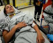 An activist from the Global Sumud Flotilla is carried on a wheel stretcher upon her arrival at Istanbul Airport on Thursday, May 21, 2026. -  Emrah Gurel, AP