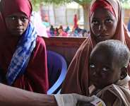 A health worker measures a Somali baby for malnutrition at Feynuus Nutrition Centre on the outskirts of Mogadishu in August, 2026. -   Farah Abdi Warsameh / AP Photo