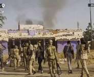 Sudans paramilitary Rapid Support Forces (RSF) fighters holding weapons and celebrating in the streets of El-Fasher in Sudans Darfur in 2025. -  AFP