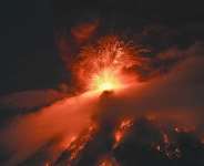 Fuego erupted on Monday morning and by nightfall it intensified, with lava flows and huge plumes of gas and ash spewed into the air. -  Johan Ordonez, AFP