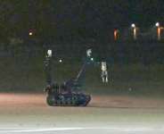 An image from video footage taken by News5 shows a bomb disposal robot at German airport Leipzig-Halle after a drone was spotted nearby. -  NEWS5/AFP