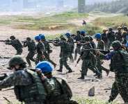 Taiwan military personnel conduct a live-fire exercise on Zhongfu Beach as part of the annual Han Kuang military exercise. -  I-Hwa Cheng, AFP