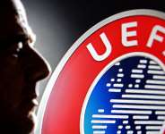 A silhouette depicting FIFA President Gianni Infantino is seen next to a UEFA logo in this illustration taken July 30, 2026. -  Dado Ruvic, Reuters