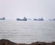 Commercial vessels are seen in the Strait of Hormuz off Bandar Abbas, Iran, 30 June 2026. -  Amirhosein Khorgooi, AP