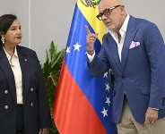 The president of the National Assembly of Venezuela, Jorge Rodrguez  talks with former opposition deputy Dinorah Figuera. -  Federico Parra, AFP