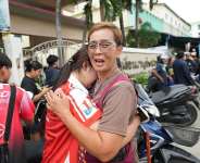 A schoolgirl cries outside her school where deaths and injuries were reported after a shooting in Thailands Nonthaburi province, August 7, 2026. -  Sakchai Lalit, AP