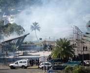 French gendarmes remove a roadblock during clashes with pro-independence protesters in Dumbea, New Caledonia, on 24 June 2024. Six Kanak activists have filed a complaint against four current or former French ministers over their arrests and transfers during the 2024 unrest. -  Delphine Mayeur/AFP