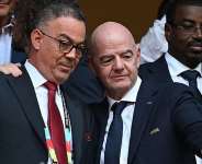 Getty ImagesImage caption: Fouzi Lekjaa (left) with Fifa president Gianni Infantino during this summers World Cup, which was co-hosted by the USA, Canada and Mexico