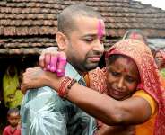 Nepali hydropower worker Sanjay Sah meets his mother at his residence in Nepals Saptari district on September 13, 2026 after being rescued from a flooded tunnel in the aftermath of deadly flash floods. - Deepesh Deo Joshi, AFP