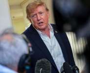 U.S. President Donald Trump speaks to members of the media aboard Air Force One, en route to Joint Base Andrews, Maryland, on September 13, 2026. -  Kylie Cooper, Reuters