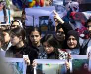 People in Syrias northeastern city of Qamishli protest against sectarian violence targeting the Alawite minority, in March 2025. -  Delil Souleiman, AFP