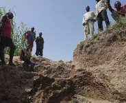 Workers stand at an illegal lithium mine in Paseli, Nigeria, 5 November 2024. -  Sunday Alamba, AP