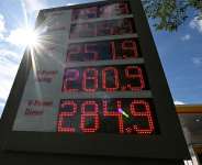 A display board showing the current prices of petrol and diesel at a gas station, in Munich, Germany on September 14, 2026. - Angelika Warmuth, Reuters