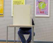 A voter marks his ballot for the state election in Mecklenburg-Western Pomerania, in Schwerin, Germany, September 20, 2026. - Jens Battner, AP