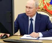In this pool photograph distributed by the Russian state agency Sputnik, Russias President Vladimir Putin votes online in the parliamentary election in Moscow on September 18, 2026. - AFP - VYACHESLAV PROKOFYEV