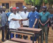 Binaba Chief donates dual desks to Binaba Primary School to end furniture crisis