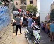 At left: this is a screengrab of a video shared on TikTok by mchalbi on August 31. Middle: This image shows bottled water being distributed. It was posted on X by the Rafael Sereti account on August 31. At right: This image shows a long line of people waiting for water being distributed by a group called Socit Lespoir in Teboulba near Monastir. - X / TikTok