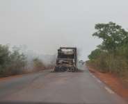 A burned truck is seen abandoned in the middle of the road leading to Sikasso, Mali in May 2026.  By - (AFP/File)