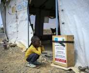 A displaced Sudanese student sitting outside a tent serving as a temporary classroom. The Middle East war is hitting UNICEFs supply chains. By Khaled DESOUKI (AFP)