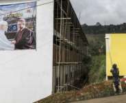 A poster portraying Pope Leo XIV (L) and Archbishop of Bamenda Andrew Nkea (R) at the Saint Joseph Metropolitan Cathedral.  By PATRICK MEINHARDT (AFP)